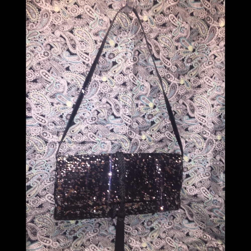 White House/Black Market’s Sequined Tassel Clutch
